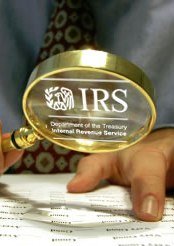 An Irs agent is inspecting a document