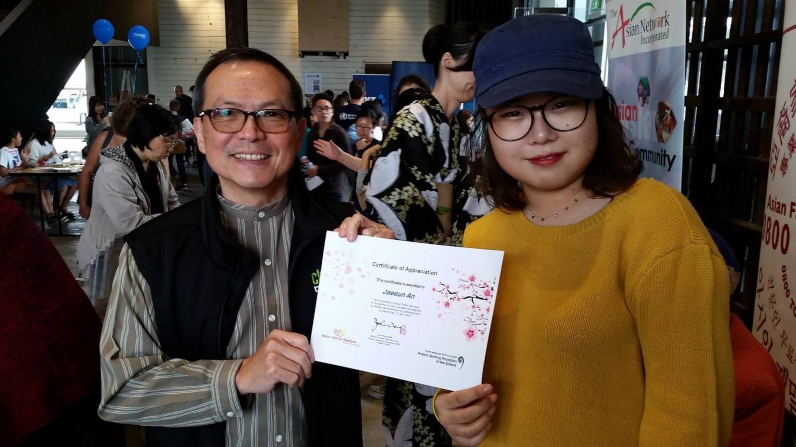 Auckland’s Asian Family Services Group’s director, John Wong, with a volunteer
