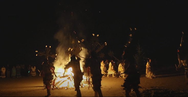 Two indian tribes divided by a bonfire (game of Kah)